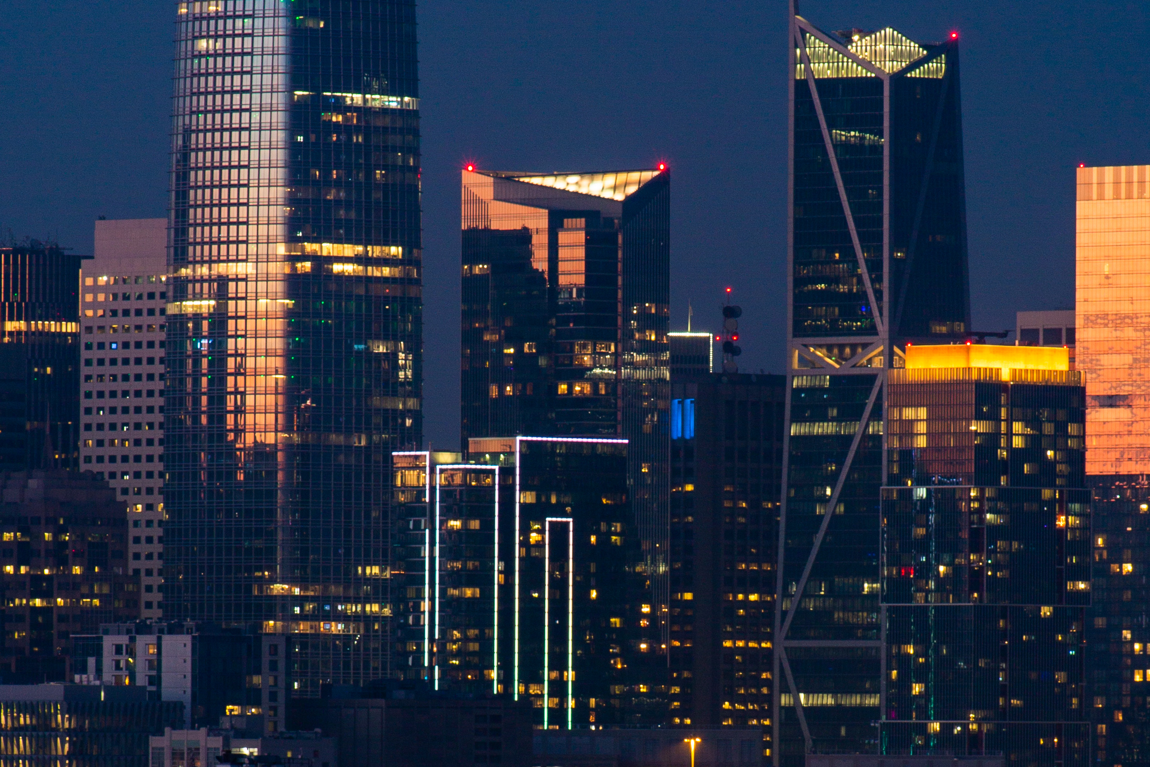 Millennium Tower at sunset between the Salesforce Tower and 181 Fremont Street, image by Andrew Campbell Nelson