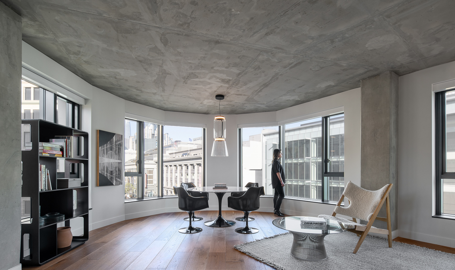 Serif SF living room with architectural concrete ceilings, image courtesy Serif