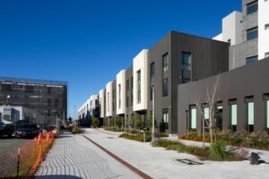 Maceo May Apartments flats overlooking a mid-block pathway, image by Andrew Campbell Nelson