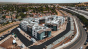 Breton Apartments aerial overview with BART visible in the background, right, image courtesy RAAM Construction
