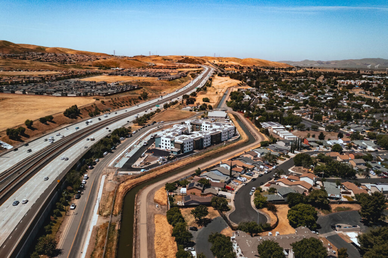 Breton Apartments overview next to State Highway 4, image courtesy RAAM Construction