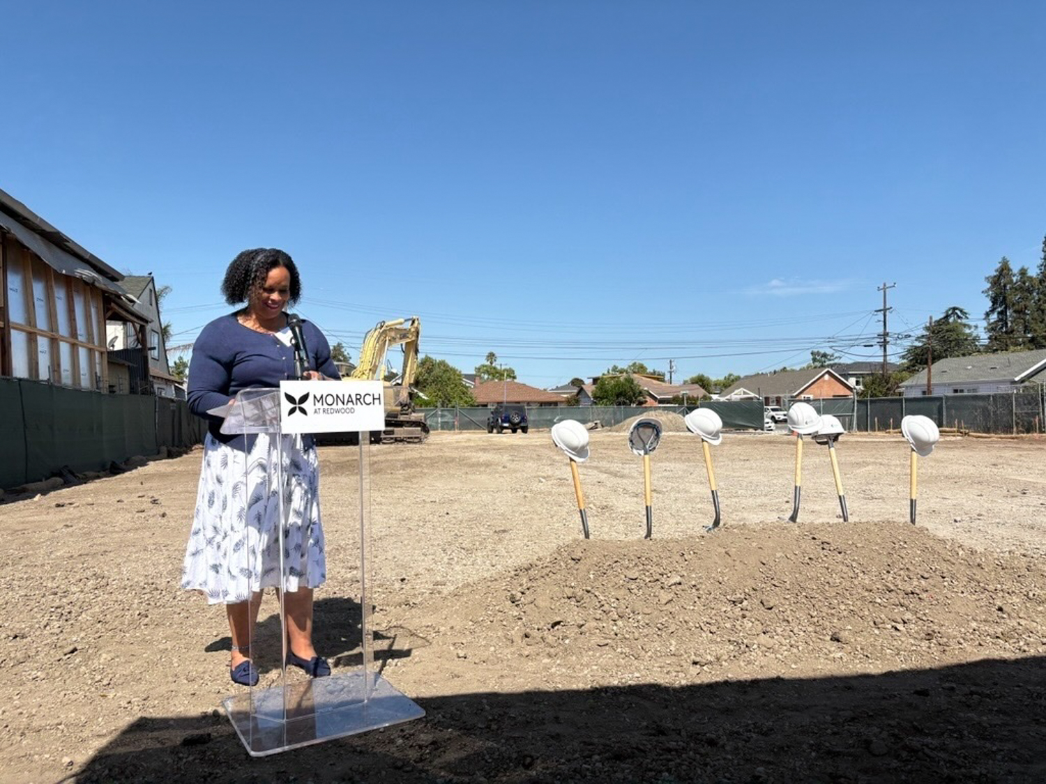 Supervisor Lisa Gauthier addresses the crowd at the Monarch at Redwood groundbreaking, image via San Mateo County